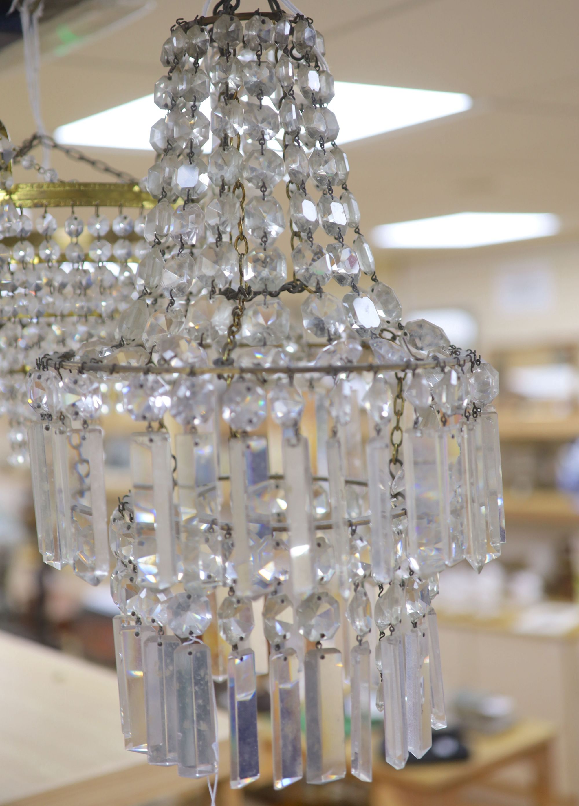 A glass lustre chandelier and another